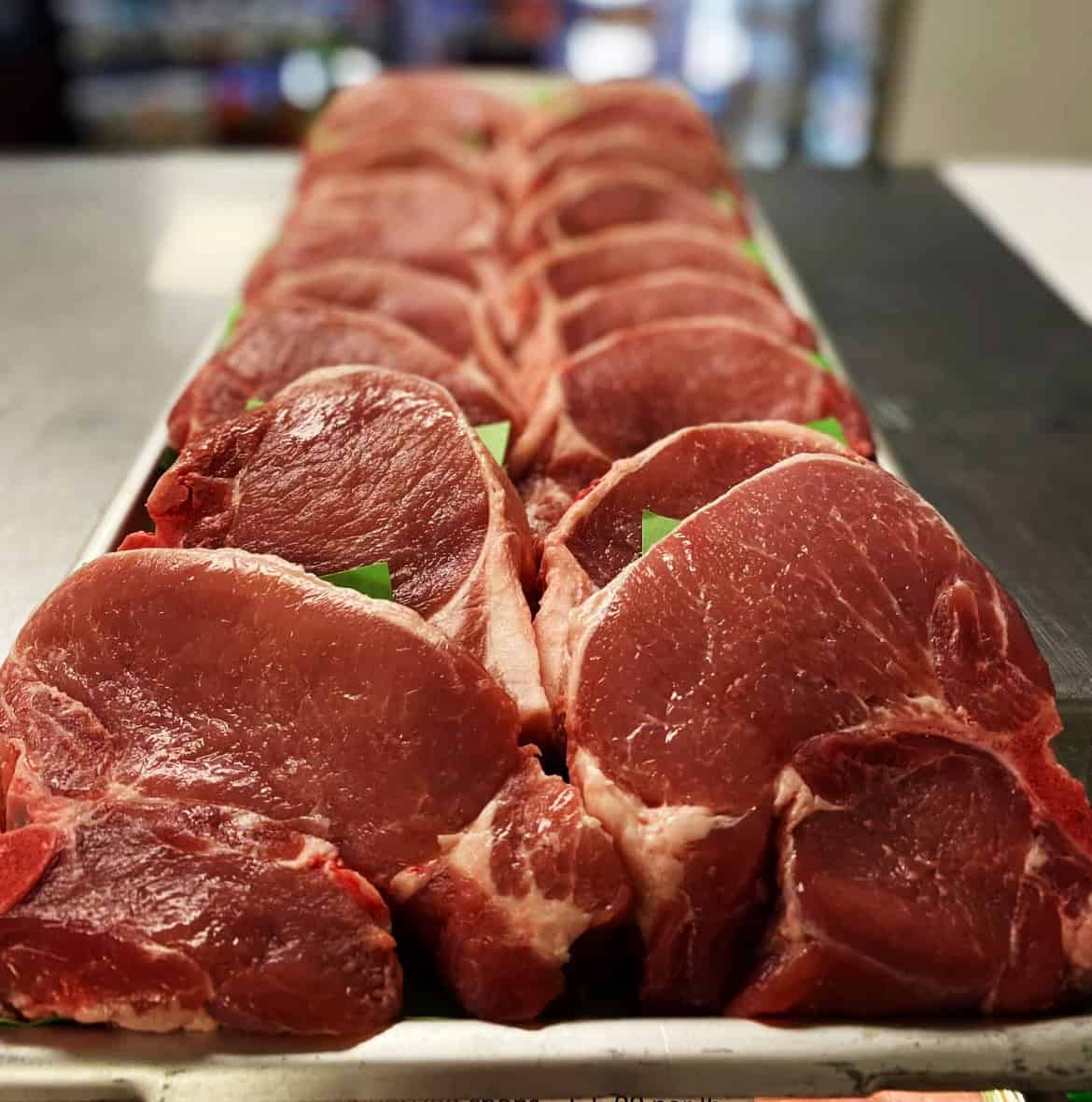 Fresh raw beef steaks at Dimes Meat Market for grilling or cooking.